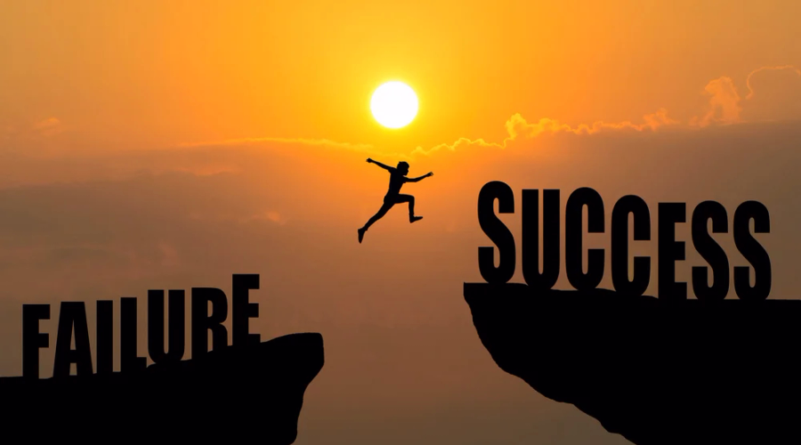 A picture of man jumping from failures to success cliffs