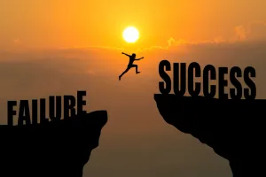 A picture of man jumping from failures to success cliffs